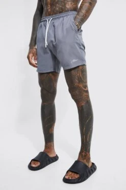 Man Signature Mid Length Swim Shorts